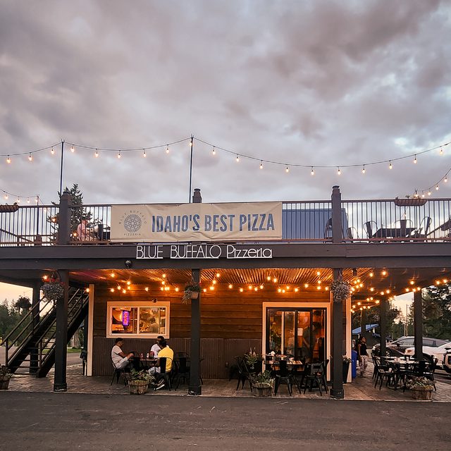 Blue Buffalo Pizzeria storefront at dusk — 'Idaho's Best Pizza' in Island Park