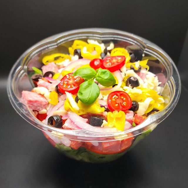 Fresh antipasto salad with salami, olives, tomato and pepperoncini