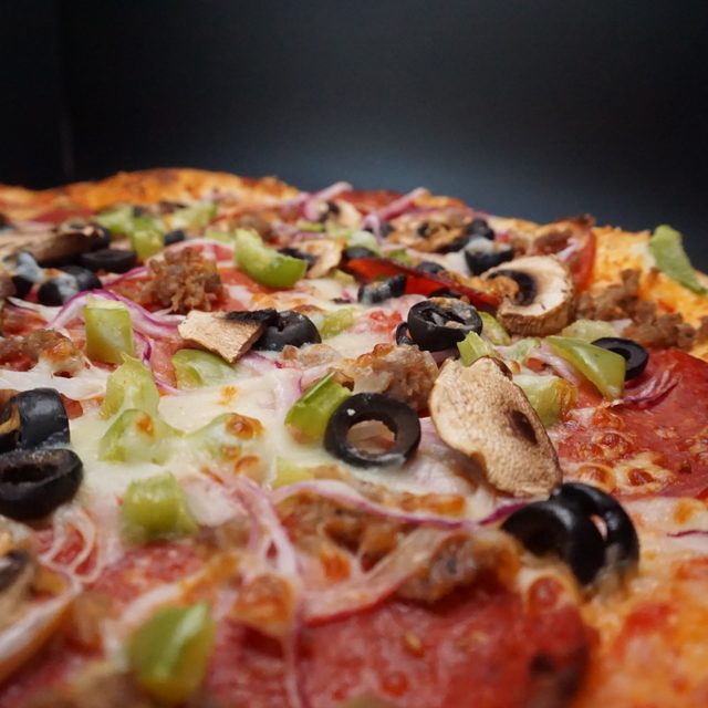 Loaded supreme pizza fresh from the oven